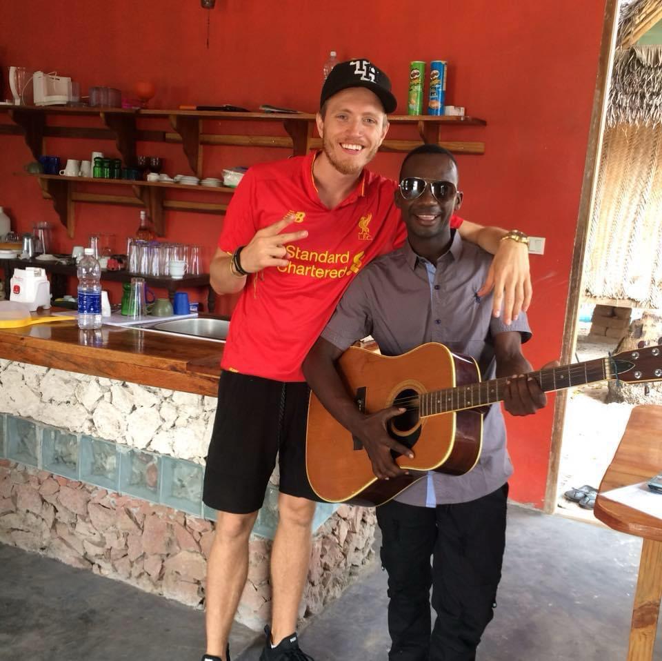 Haji and a guest with a guitar at the Kilimani kitchen bar