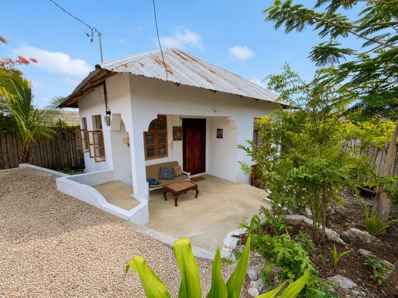 Garden House exterior view through tropical plants