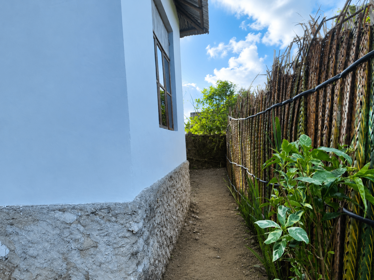 Bamboo fence and garden path approaching the Garden House